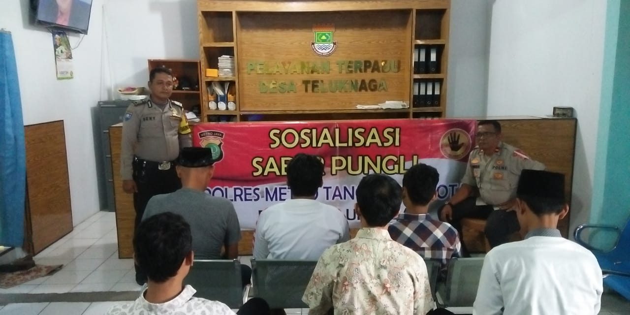 Bhabinkamtibmas Ds. Teluknaga Dampingi Kanit Binmas Mensosialisasikan Tentang Satgas Saber Pungli