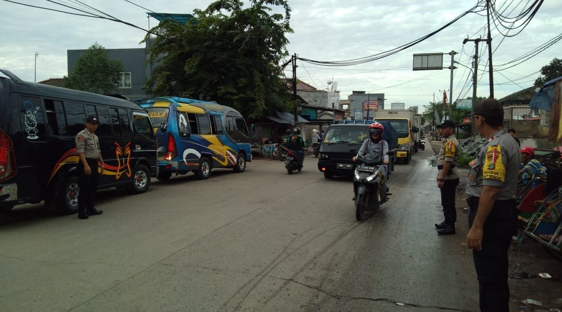 PENGGELARAN PERSONIL POLSEK TELUKNAGA BENTUK PELAYANAN PENGATURAN LALU LINTAS DITITIK RAWAN MACET