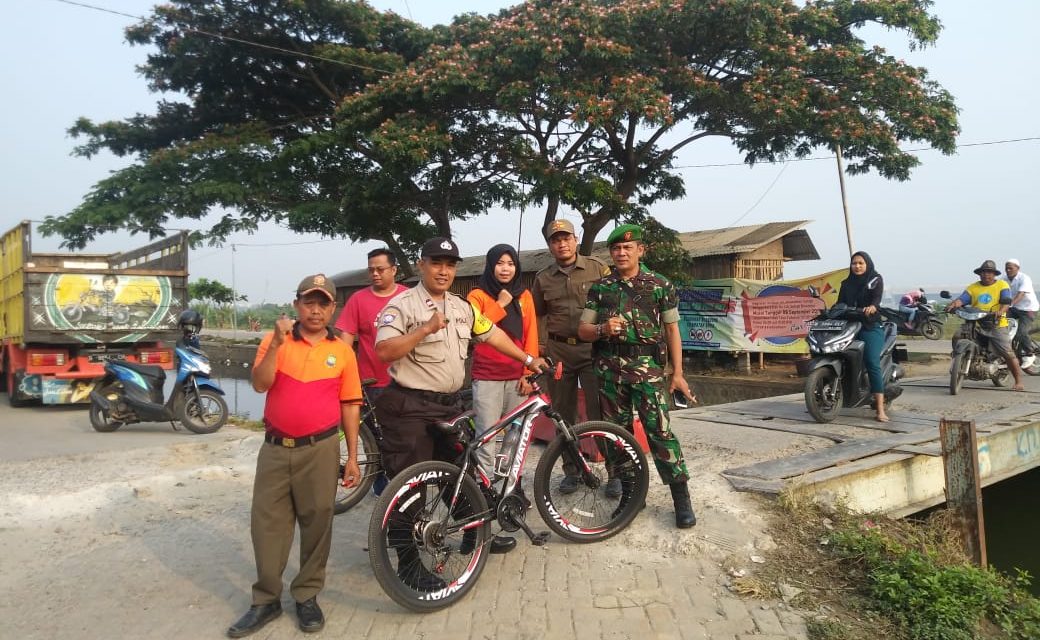 Bhabinkamtibmas Kelurahan Belendung Aiptu Pamuk Wiyono Kawal Jalannya CFD Di Belendung